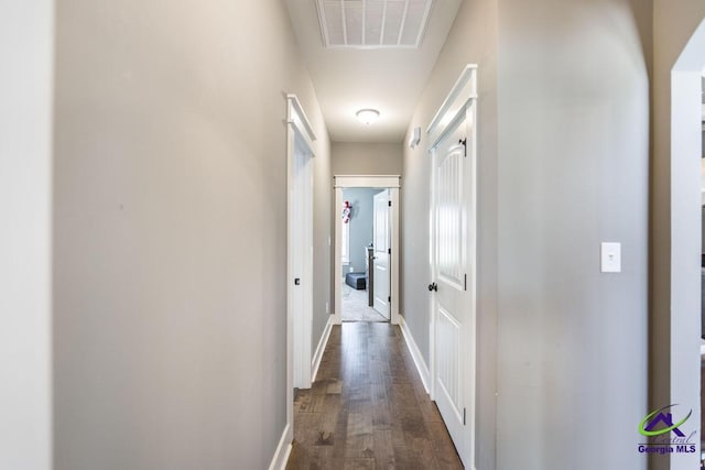 217 Woodlands Blvd, Kathleen, GA 31047 - hallway featuring dark wood-style floors and baseboards
