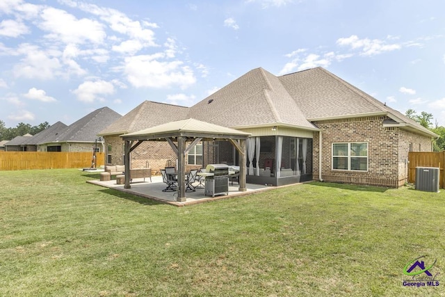 217 Woodlands Blvd, Kathleen, GA 31047 - rear view of property featuring a gazebo, central AC unit, roof with shingles, a patio, and brick siding