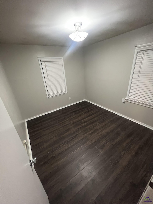 318 Vick St, Albany, GA 31705 - unfurnished room featuring baseboards and dark wood finished floors