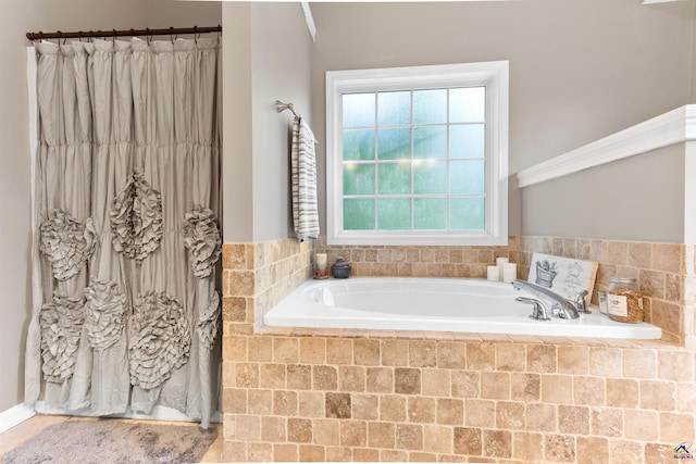 full bath with curtained shower and a bath