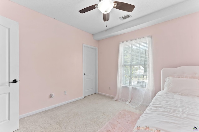 bedroom with visible vents, baseboards, a ceiling fan, and carpet floors
