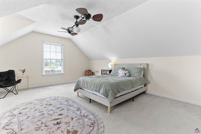 bedroom with ceiling fan, lofted ceiling, carpet flooring, and baseboards