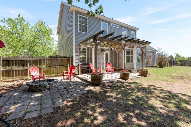 back of property featuring an outdoor fire pit, a patio area, a pergola, and fence private yard