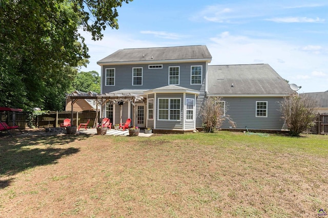 rear view of property with a lawn, a patio area, a pergola, and a fenced backyard