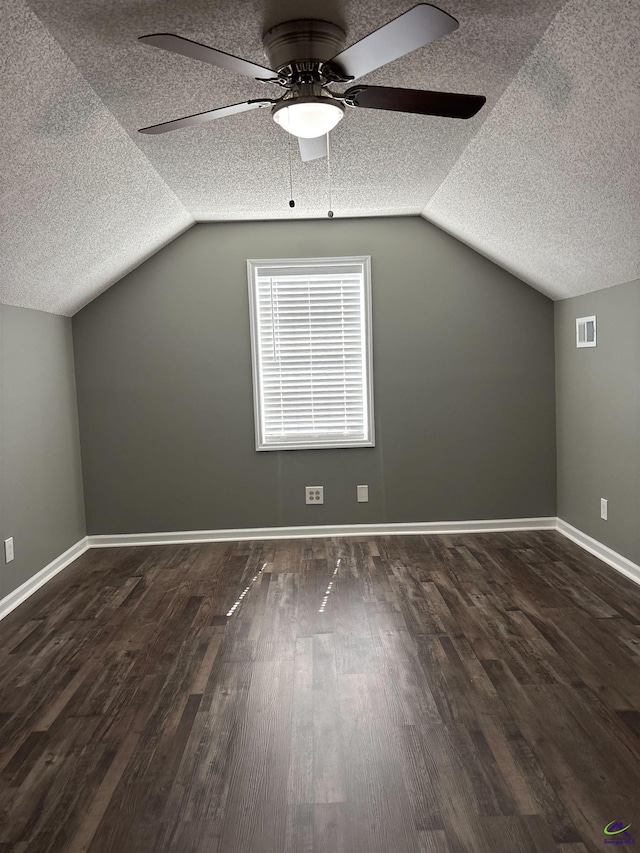 4211 Cyndy Jo Cir, Macon, GA 31216 - additional living space featuring a textured ceiling, ceiling fan, vaulted ceiling, wood finished floors, and baseboards