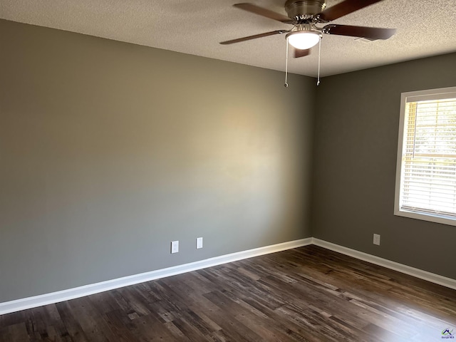 4211 Cyndy Jo Cir, Macon, GA 31216 - unfurnished room with dark wood finished floors, a textured ceiling, ceiling fan, and baseboards