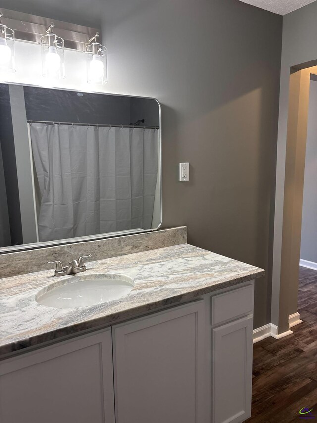 4211 Cyndy Jo Cir, Macon, GA 31216 - full bath featuring wood finished floors, baseboards, and vanity