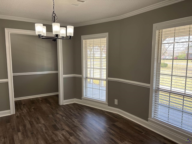 4211 Cyndy Jo Cir, Macon, GA 31216 - unfurnished dining area with a chandelier, dark wood-style floors, ornamental molding, baseboards, and a textured ceiling