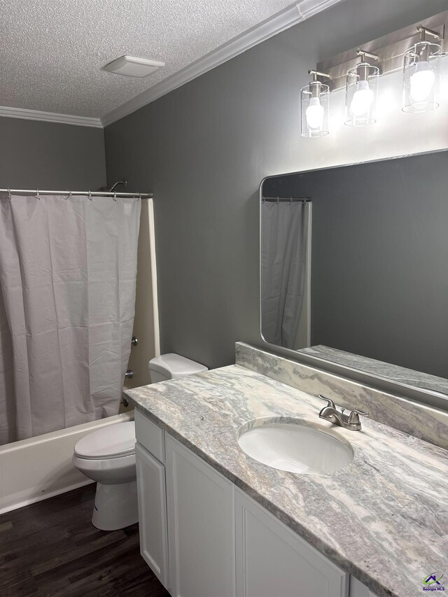 4211 Cyndy Jo Cir, Macon, GA 31216 - full bath featuring a textured ceiling, wood finished floors, crown molding, toilet, and vanity