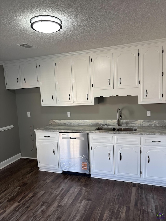 4211 Cyndy Jo Cir, Macon, GA 31216 - kitchen featuring stainless steel dishwasher, a sink, white cabinetry, a textured ceiling, and dark wood-type flooring