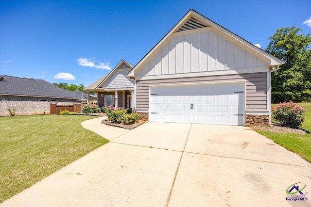 view of front of home featuring board and batten siding, stone siding, an attached garage, and driveway