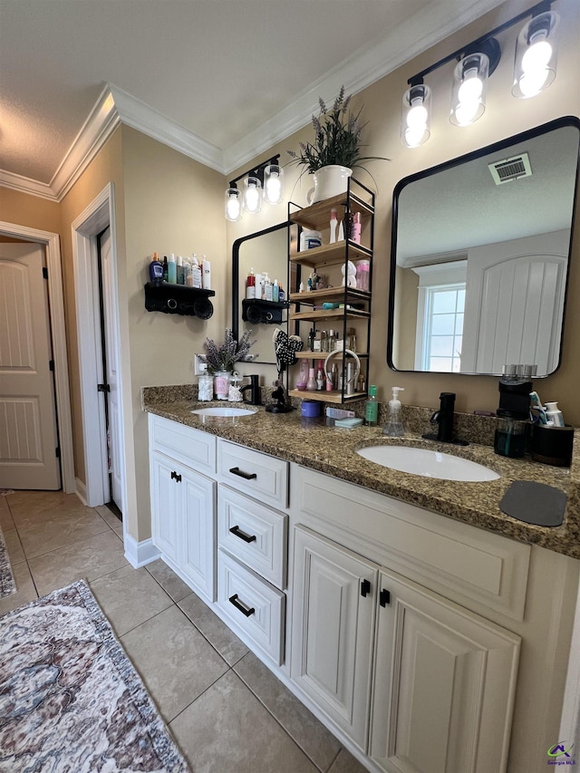 full bath with crown molding, double vanity, and tile patterned floors