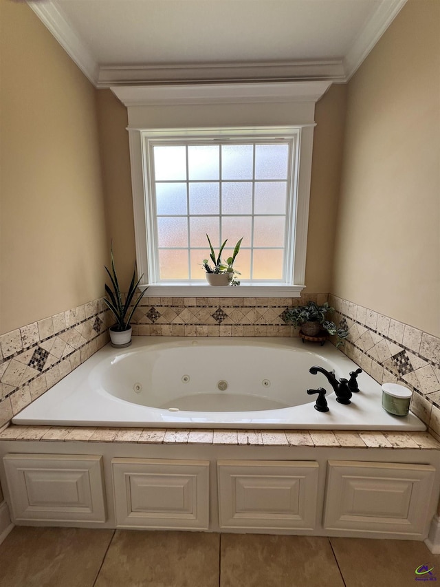 bathroom with ornamental molding, a whirlpool tub, and tile patterned floors