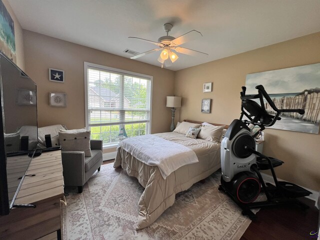 bedroom with light wood finished floors and ceiling fan