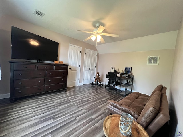 living room with dark wood-style floors, a ceiling fan, baseboards, and lofted ceiling