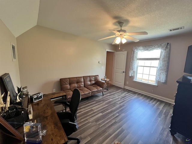 office space featuring ceiling fan, wood finished floors, baseboards, and vaulted ceiling