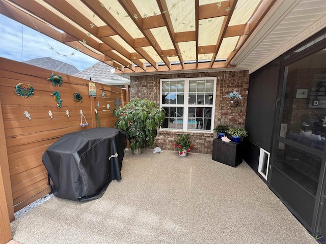 view of patio featuring fence and area for grilling