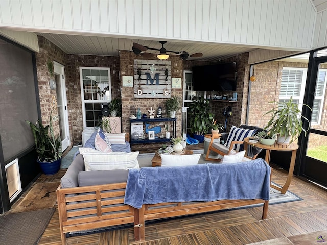 view of patio featuring a ceiling fan and outdoor lounge area