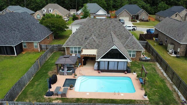 view of swimming pool featuring a gazebo and a residential view
