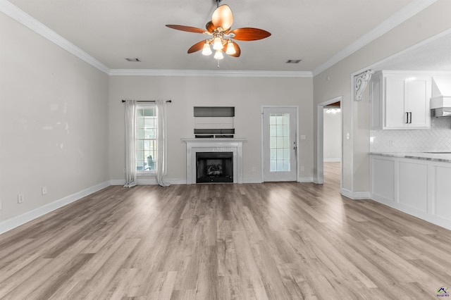 465 Pitts Rd, Hawkinsville, GA 31036 - unfurnished living room with ceiling fan, ornamental molding, light wood finished floors, a fireplace, and baseboards
