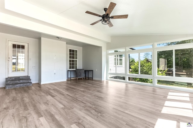 465 Pitts Rd, Hawkinsville, GA 31036 - unfurnished living room with ceiling fan, vaulted ceiling, baseboards, and wood finished floors