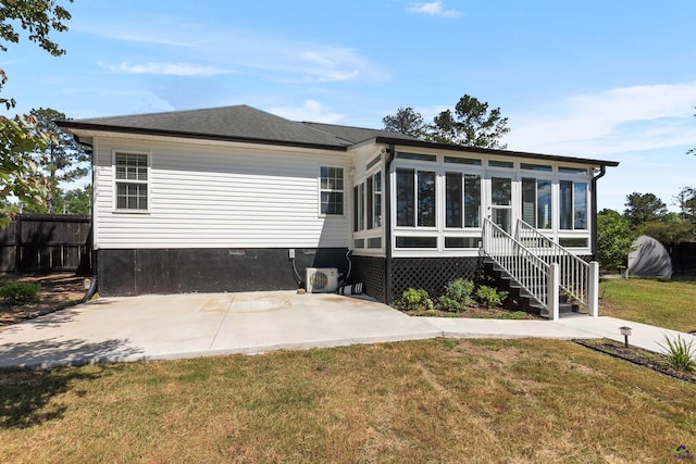 465 Pitts Rd, Hawkinsville, GA 31036 - rear view of house featuring a sunroom and a patio