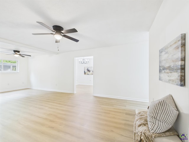 104 Karen Dr, Warner Robins, GA 31088 - unfurnished living room with ceiling fan, light wood-style floors, and baseboards