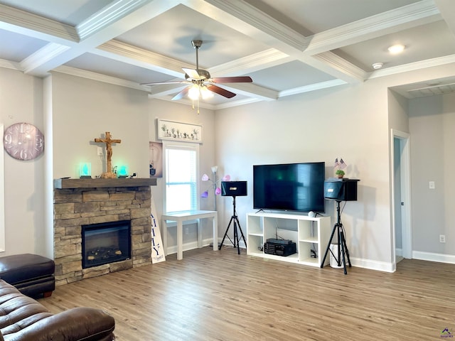 living area featuring coffered ceiling, wood finished floors, baseboards, ceiling fan, and ornamental molding