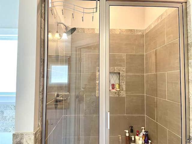 full bath with a shower stall