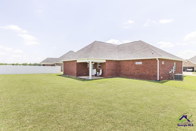 view of property exterior with brick siding, cooling unit, a patio area, and a shingled roof