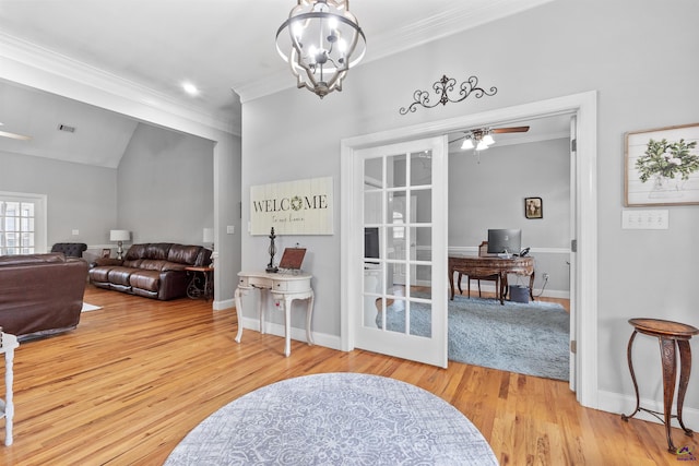 living room featuring an office area, crown molding, wood finished floors, a ceiling fan, and baseboards