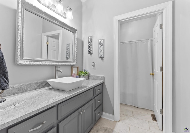 bathroom featuring vanity and tile patterned flooring