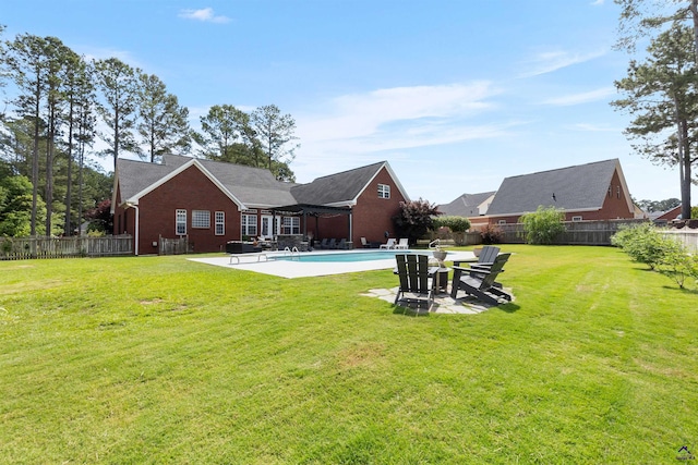back of property with a patio and brick siding