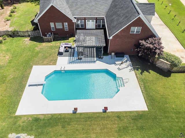 view of swimming pool with a patio and a diving board