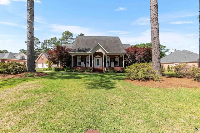 view of front of property with a porch and a front yard