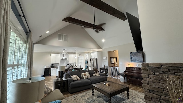 17 Creekside Trl, Forsyth, GA 31029 - living room with high vaulted ceiling, wood finished floors, ceiling fan, recessed lighting, and beam ceiling