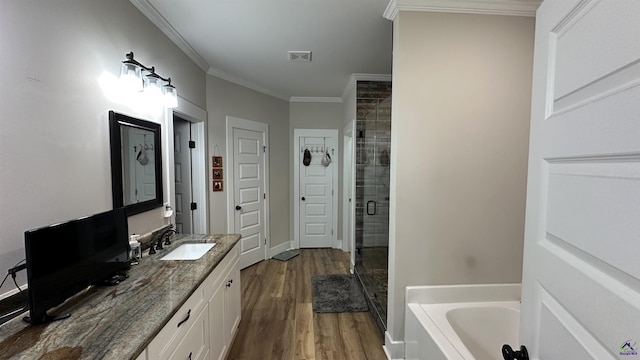 17 Creekside Trl, Forsyth, GA 31029 - full bath with a shower stall, a bath, wood finished floors, ornamental molding, and vanity