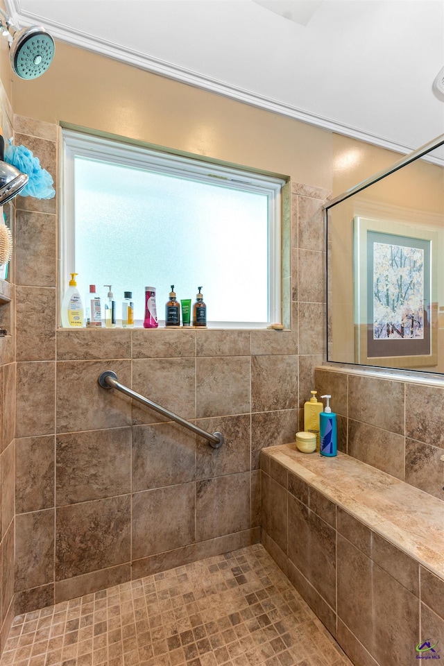 full bath featuring a tile shower