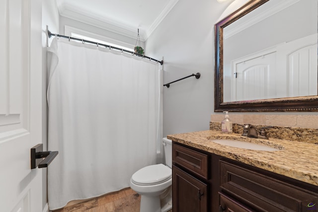 full bathroom with ornamental molding, toilet, vanity, and a shower with shower curtain