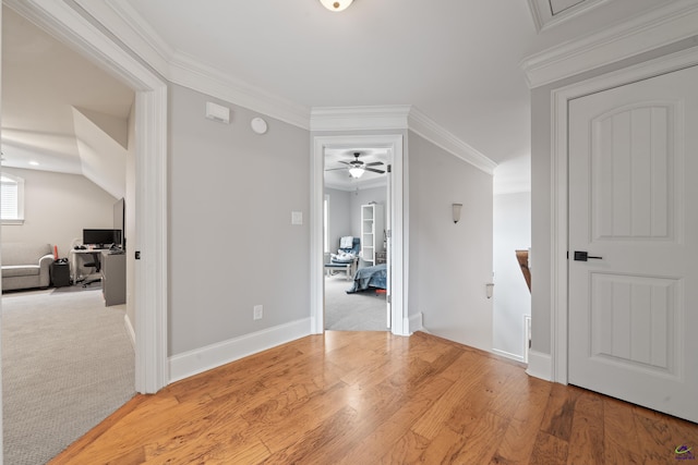 additional living space featuring an office area, a ceiling fan, baseboards, and light wood finished floors