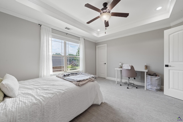 carpeted bedroom featuring ornamental molding, a raised ceiling, recessed lighting, baseboards, and a ceiling fan