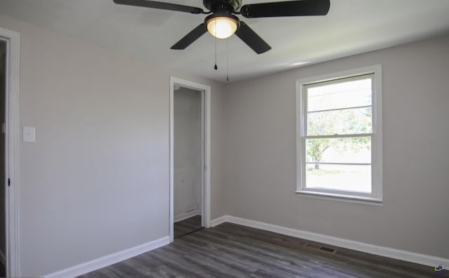 110 Wimberly Rd, Hawkinsville, GA 31036 - unfurnished room featuring baseboards, dark wood-style flooring, and a ceiling fan