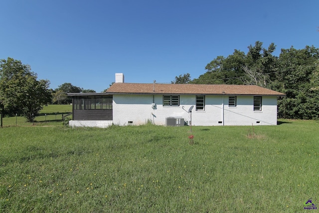 118 Wimberly Rd, Hawkinsville, GA 31036 - view of front of property with a chimney, central AC, crawl space, a sunroom, and brick siding