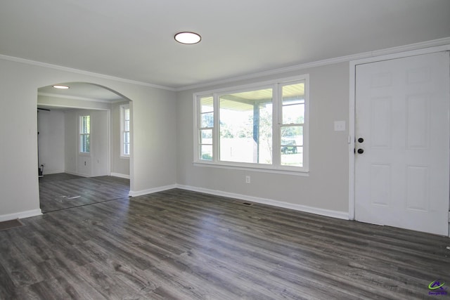 118 Wimberly Rd, Hawkinsville, GA 31036 - unfurnished living room with arched walkways, ornamental molding, baseboards, plenty of natural light, and dark wood finished floors