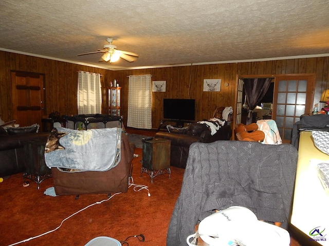 7085 US Highway 341 S, Roberta, GA 31078 - carpeted living room featuring wood walls, ceiling fan, a textured ceiling, and ornamental molding