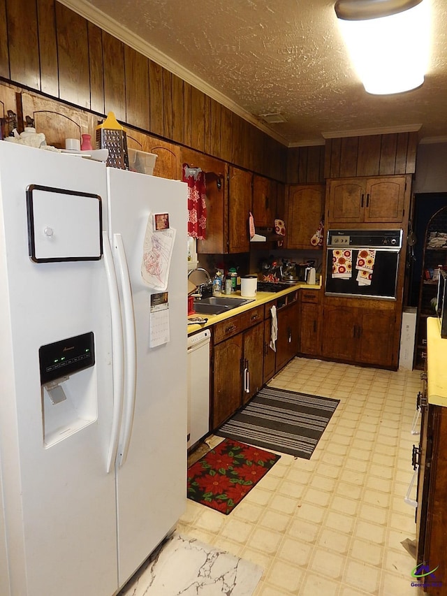 7085 US Highway 341 S, Roberta, GA 31078 - kitchen with white appliances, light floors, a sink, crown molding, and light countertops