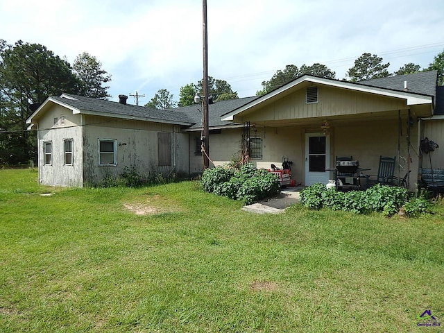 7085 US Highway 341 S, Roberta, GA 31078 - rear view of house with a yard, a patio, and roof with shingles