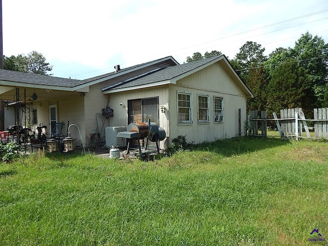 7085 US Highway 341 S, Roberta, GA 31078 - back of property featuring a shingled roof, ceiling fan, and cooling unit