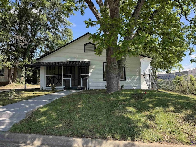 view of front of house with a front yard and stairs