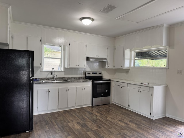 kitchen featuring freestanding refrigerator, stainless steel range with electric cooktop, a sink, under cabinet range hood, and ornamental molding